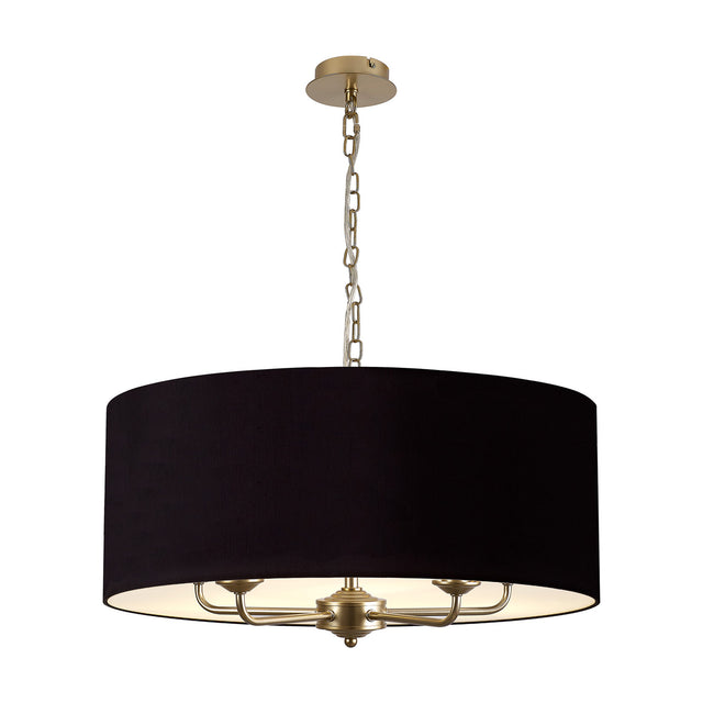 Banyan 5 Light Pendant Light, 60cm midnight black drum shade with champagne gold interior, five-arm champagne gold frame and chain, plain white background.