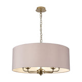 Banyan 5-light fabric pendant with a grey drum shade and champagne gold arms and chain, suspended on a plain white background.