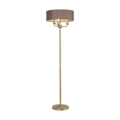 Banyan 3 Light E14 floor lamp with a wide grey fabric drum shade on champagne gold candelabra arms, slender stem and round stepped base, shown on a plain white background.