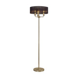 Banyan 3 Light E14 floor lamp with a wide black organza drum shade on a slim champagne gold stand, three candle-style bulbs visible, round base, set on a plain white background.