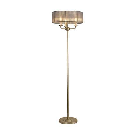 Banyan 3 Light E14 Floor Lamp with a slim champagne gold column and 45cm grey organza drum shade housing three candle lights, shown on a plain white background.