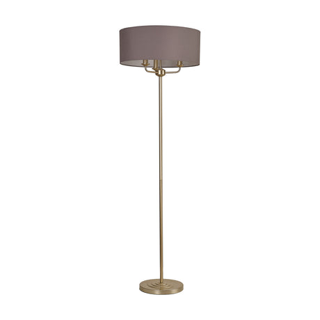 Banyan Floor Lamp with a wide grey drum shade over three E14 lights, set on a slim champagne gold stem and round base, shown on a plain white background.