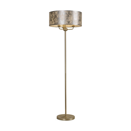 Banyan 3 Light E14 Floor Lamp with a champagne gold stem and base, topped by a wide 50cm silver leaf drum shade, shown against a plain white background.