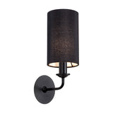 Banyan E14 wall light, 35.5cm high, with a black cylindrical fabric shade on a matt black curved arm and round wall backplate, shown on a plain white background.