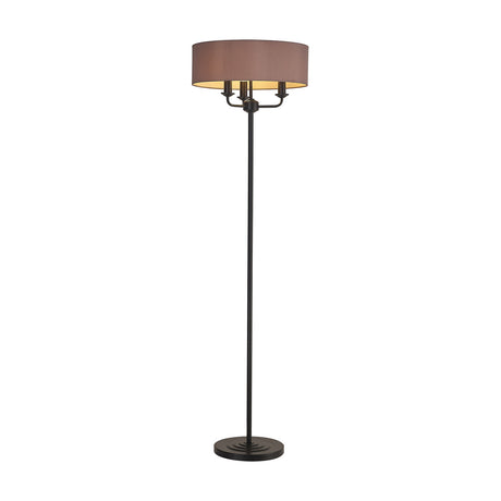 Banyan Floor Lamp with a wide taupe drum shade and gold interior over three candle lights, on a slim matt black stem and round base, shown on a white background.