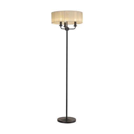 Banyan Floor Lamp with 45cm cream terylene drum shade over three candle-style lights on a matt black iron stem and round base, shown on a plain white background.