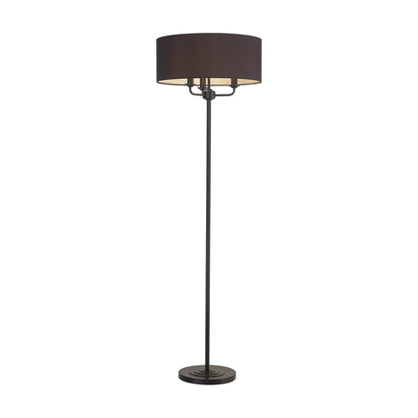 Banyan Floor Lamp with matt black stem and base, three-light drum shade in black fabric with white lining, 50cm diameter, on a plain white background.