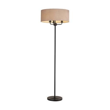 Banyan 3 Light E14 Floor Lamp with a 50cm nude beige fabric drum shade atop a slim matt black stand and round base, shown on a plain white background.