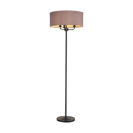Banyan Floor Lamp with a 50cm taupe faux silk drum shade over three candle lights, matt black stem and round base, shown on a plain white background.