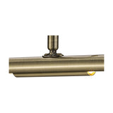 Close-up of the Abacus picture light's antique brass mounting bracket and slim horizontal bar with a lit G9 capsule visible, shown on a white background.