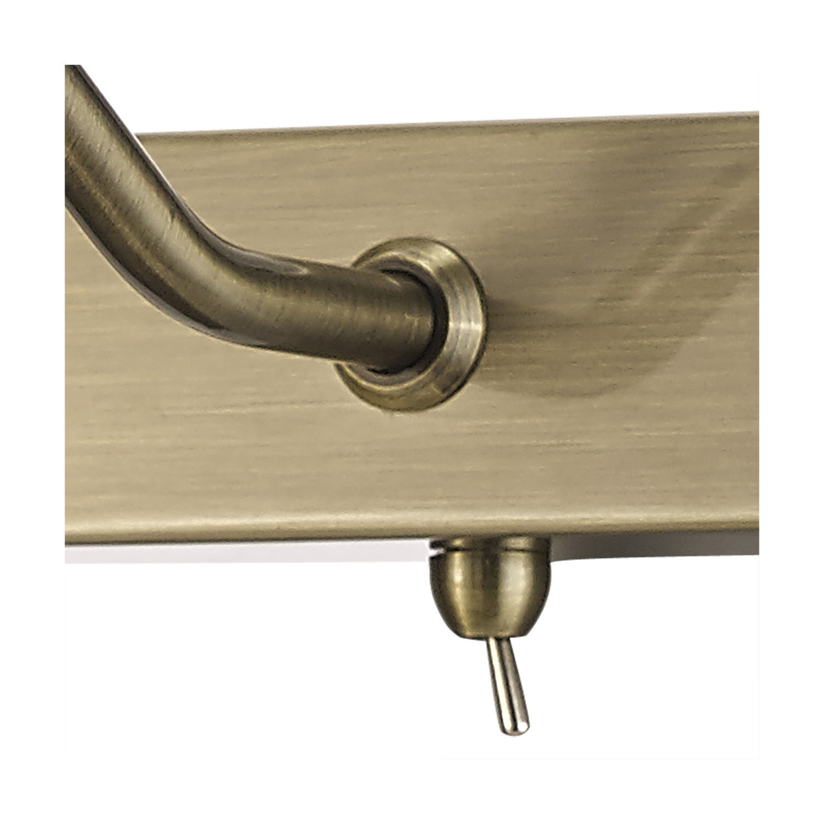 Close-up of the Abacus 2 Light Switched Picture Light in antique brass, showing the curved wall bracket, toggle switch, and mounting plate on a white background.