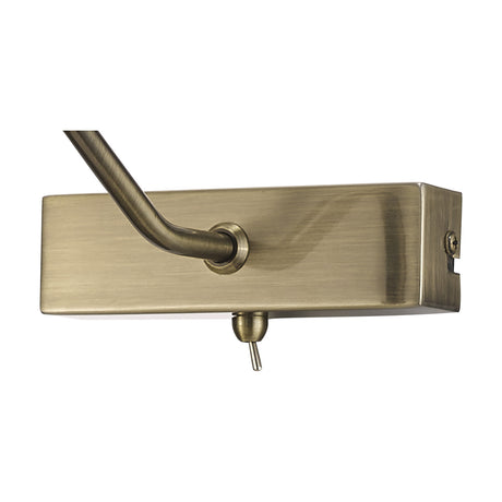 Abacus 2 Light Switched Picture Light in antique brass, close-up of the rectangular bar with curved arm, toggle switch, and mounting screw on a plain white background.
