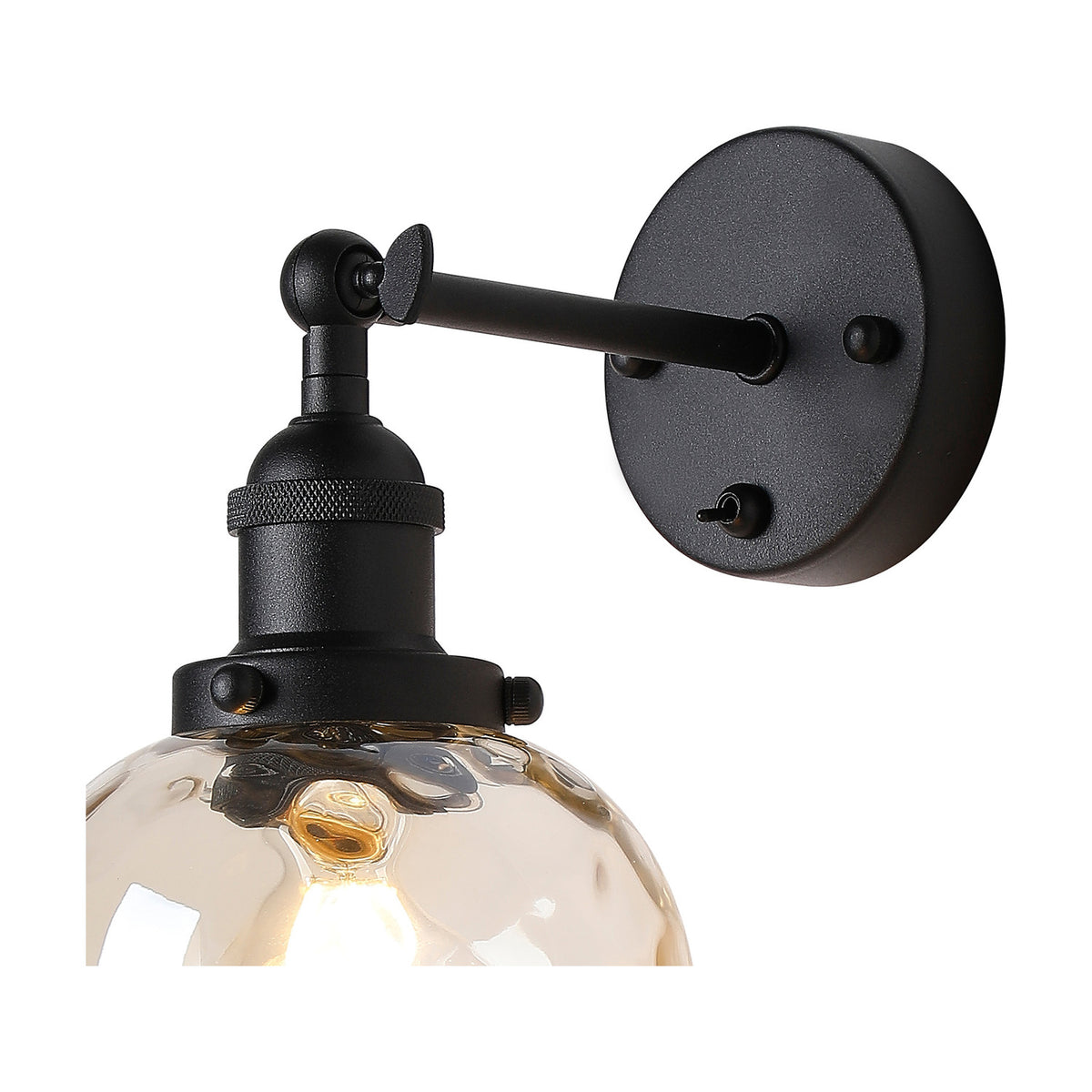 Cawdor wall light in matt black with an angled arm and round wall plate, holding an E27 bulb in a champagne dimpled glass shade, shown on a white background.