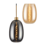 Pendant light with elongated oval glass shades in smoke and amber finish, each with an antique gold fitting and visible spiral filament bulb, shown against a plain white background.