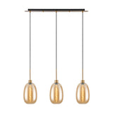 3 Light Linear Amber Glass Pendant Light with antique gold bar and cords, three oval amber glass shades with gold fittings, lit bulbs, on a plain white background.