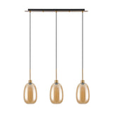 3 Light Linear Amber Glass Pendant Light with elongated oval shades on antique gold cords and canopy, 85cm bar, plain white background.
