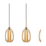 3 Light Linear Amber Glass Pendant Light, 85cm, with egg-shaped shades on antique gold cords and fittings, shown on a plain white background.