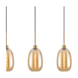 3 Light Linear Amber Glass Pendant Light with antique gold fittings, showing lit oval-curved shades on slim rods against a plain white background.