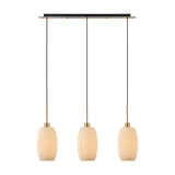 Lori 3 Light Ribbed Opal Linear Glass Pendant with antique gold ceiling bar and adjustable cords, shown on a plain white background.