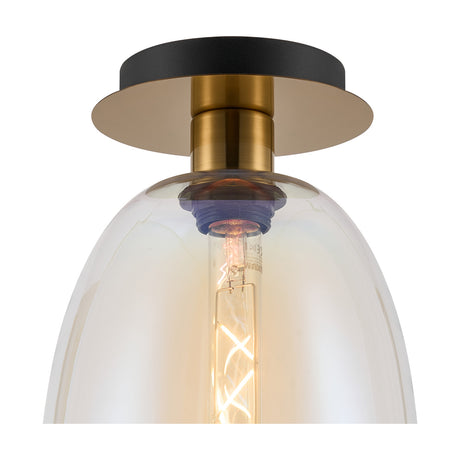 Close-up of the Lori flush ceiling light with an iridescent glass shade, exposed E27 bulb, and antique gold ceiling plate against a black mount, on a plain white background.