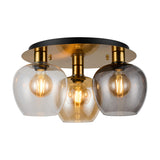 Lori 3 Light Flush Light with amber, clear, and smoke glass wine-shaped shades under a round antique gold ceiling plate, shown on a white background.