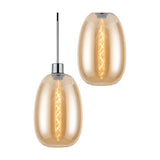 Lori pendant light shade shown singly and paired, tall amber glass trapezium shade with visible filament bulb and polished chrome fitting, on a plain white background.