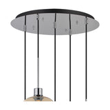 Close-up of the Lori 5-light pendant's 45cm polished chrome ceiling plate with black flexes and chrome connectors, one amber wine-glass shade visible, on white background.
