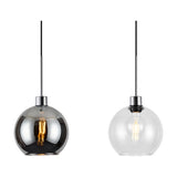 Lori 3 Light Pendant showing two round globe shades on polished chrome drop rods, one in smoke-tinted glass and one in clear glass with visible bulb, against a plain white background.