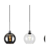 Lori pendant lights with round glass globe shades in smoke and clear finishes, polished chrome fittings, black cords, visible bulbs, on a white background.