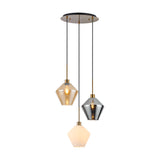 3-light pendant with round satin nickel ceiling plate and three diamond-cut glass shades in amber, chrome and opal at staggered heights, shown on a white background.