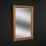 The Deco Rectangle Wall Mirror - Copper, featuring a golden brown frame with a layered design that adds depth and elegance, is mounted on a dark textured wall as part of this modern home decor.