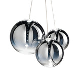 The Diverso LED Pendant Light - Chrome features three reflective glass orbs of different sizes, suspended by thin wires against a white background, showcasing mirrored reflections and glossy chrome surfaces.