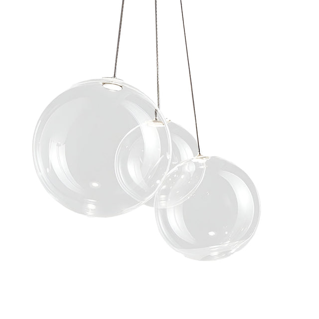 Niori Diverso 3 Light LED Cluster Pendant with three clear blown-glass globes in varying sizes hanging from slim cables against a white background.