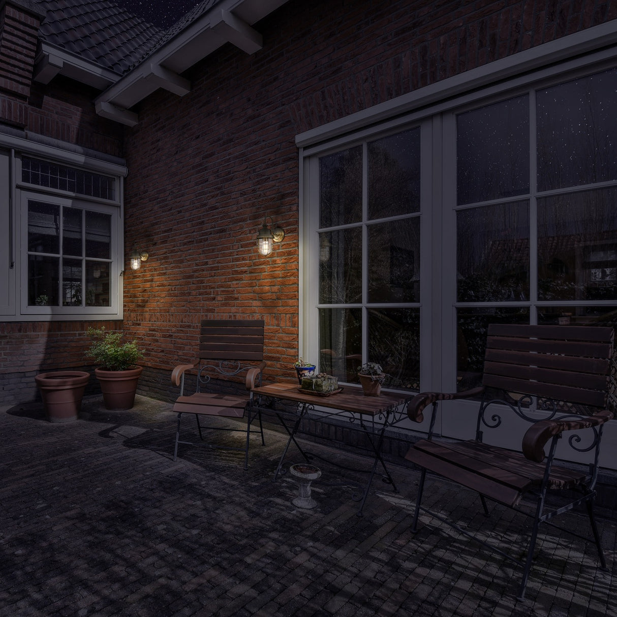 Wharf exterior wall light, shown in a garden setting