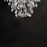 Wisteria 8 light ceiling light in chrome finish, shown on a dark background