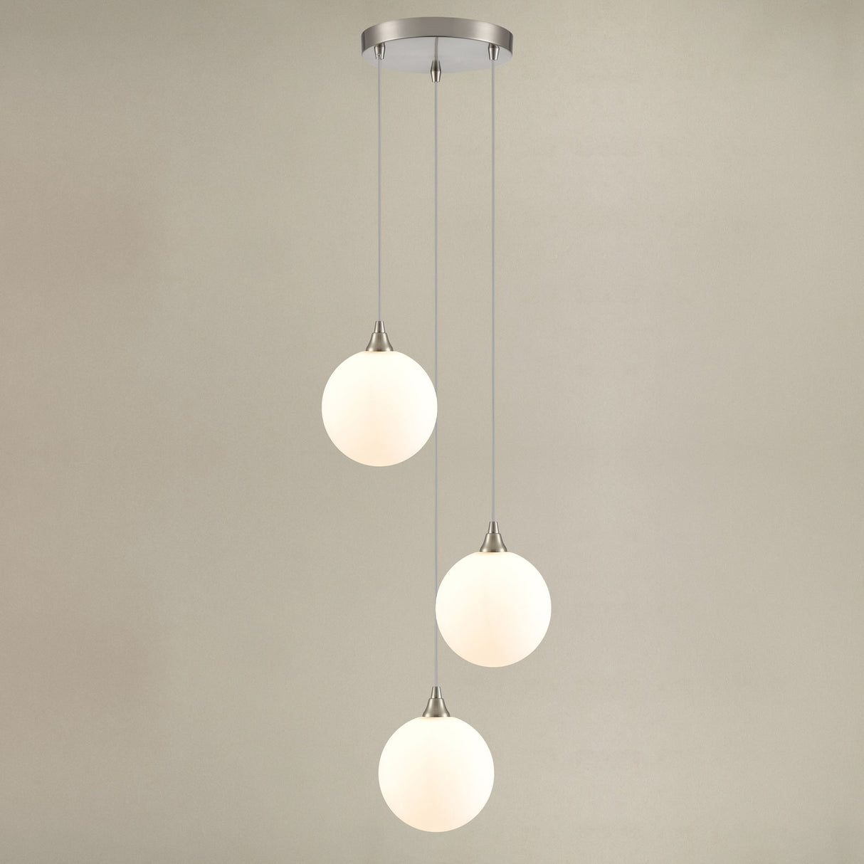 Galaxy 3 light pendant light in satin nickel finish, shown on a dark background