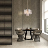 Icicle 5 light pendant light in brass finish, shown in a room setting