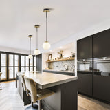 Vermeer ceiling light in black and gold finish, shown in a room setting