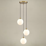 Galaxy 3 light pendant light in gold finish, shown on a dark background