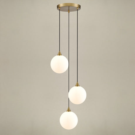 Galaxy 3 light pendant light in gold finish, shown on a dark background