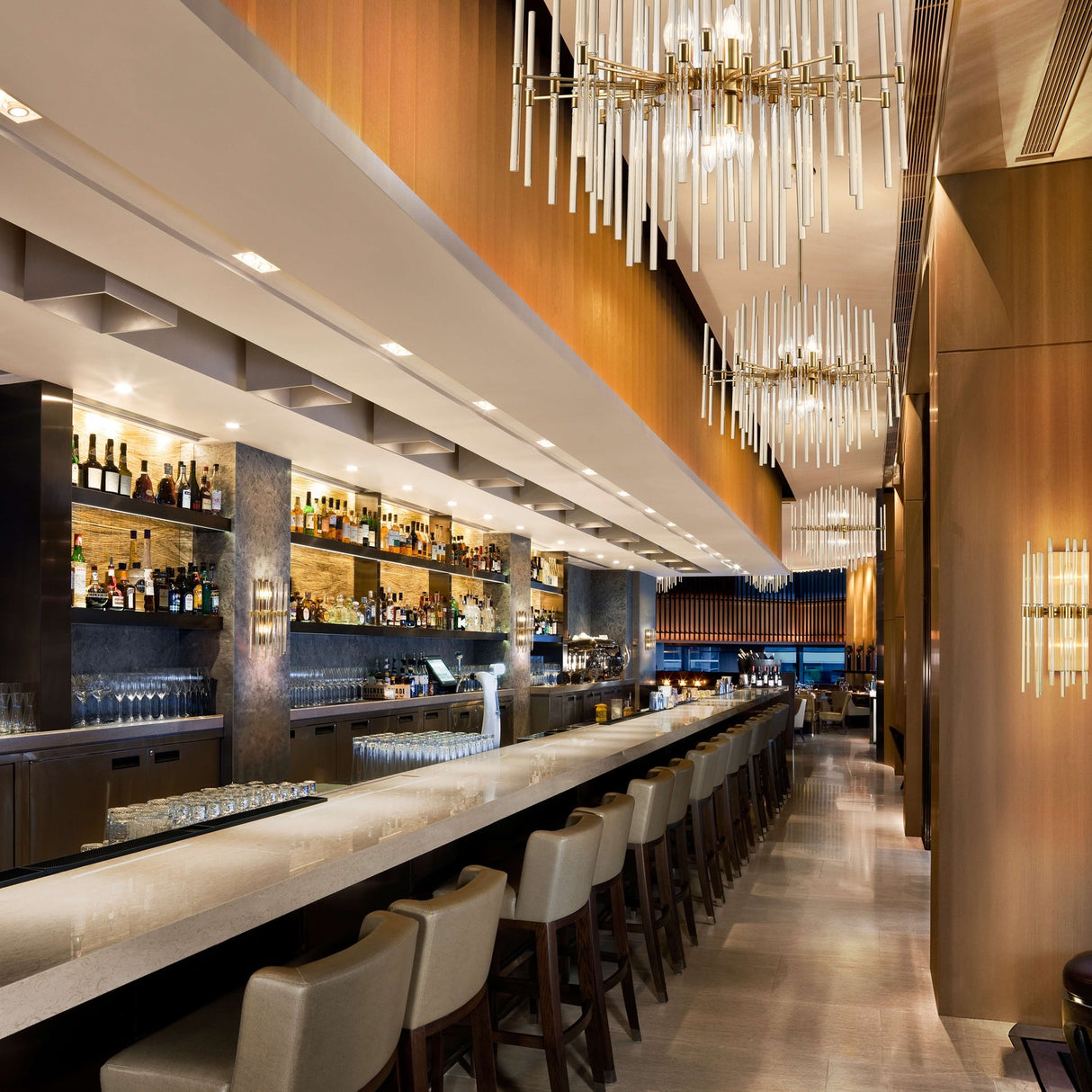 Celestial 10 light chandelier in brass finish, shown in a room setting