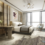 Trapeze 5 light ceiling light in brass finish, shown in a room setting