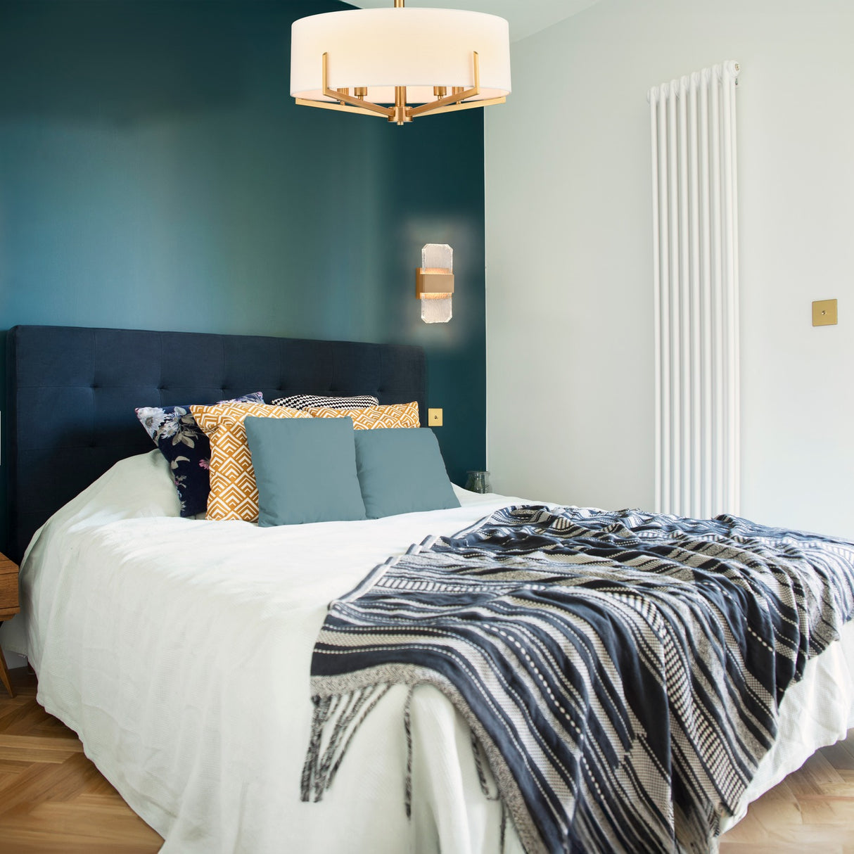 Clifton 5 light chandelier in brass finish, shown in a room setting