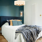 Clifton 5 light chandelier in brass finish, shown in a room setting