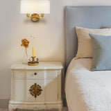 Windsor 2 light wall light in brass finish, shown in a room setting