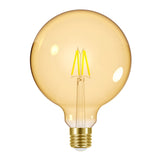 The Energizer 5W G125 Dimmable LED Globe Gold Filament Bulb offers a vintage-style design with its round amber globe and visible filaments. It features a brass E27 screw base and emits a warm white glow at 2200K against a white background. This elegant LED light is not only energy efficient but also enhances charm while conserving power.