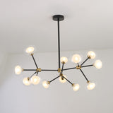 Niori Galaxy 12 Light Branching Chandelier with matt black asymmetric arms, brushed brass collars and clear glass globes, shown lit against a white ceiling.