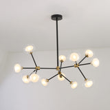 Niori Galaxy 12 Light Branching Chandelier with asymmetric matt black arms, brushed brass collars and clear glass globes, mounted to a white ceiling.