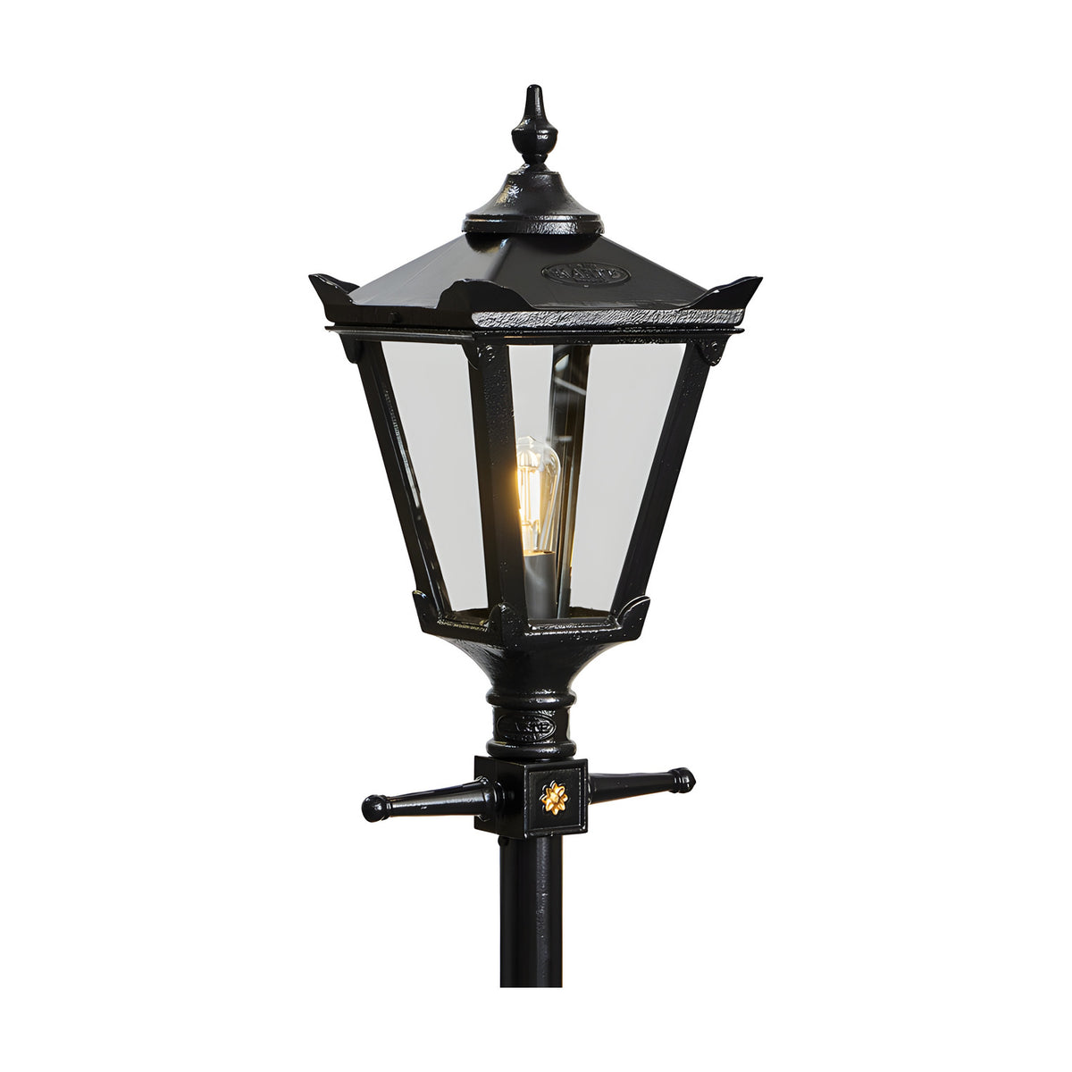 Victorian cast iron lamp post in black with tapered four-sided glass head, cast finial, corner tips and decorative bracket detail, shown on a plain white background.