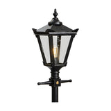Victorian cast iron lamp post in black with tapered four-sided glass head, cast finial, corner tips and decorative bracket detail, shown on a plain white background.